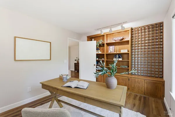 a bed room with a bed and a large window