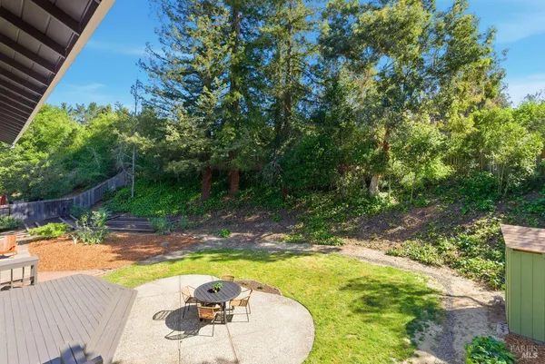 an aerial view of a house with a yard and potted plants