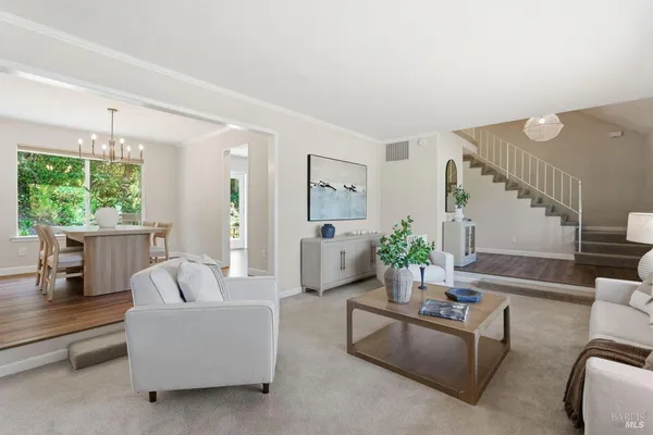 a dining room with furniture and window