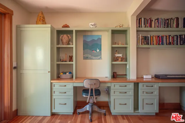 a view of a workspace with furniture