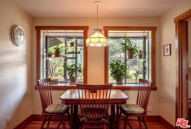 a view of a dining room with furniture window and outside view