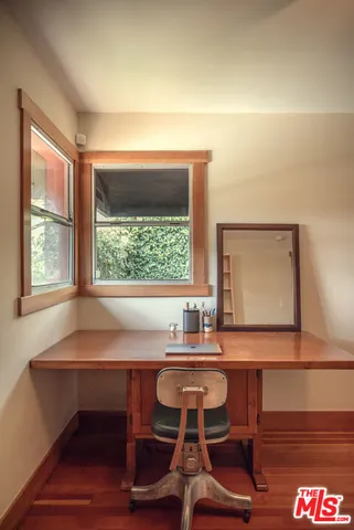 a workspace with pool table and a window