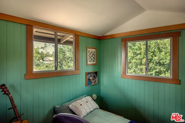 a room with a window and a fan