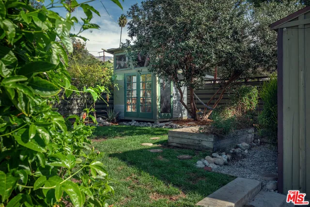 a view of a backyard with plants