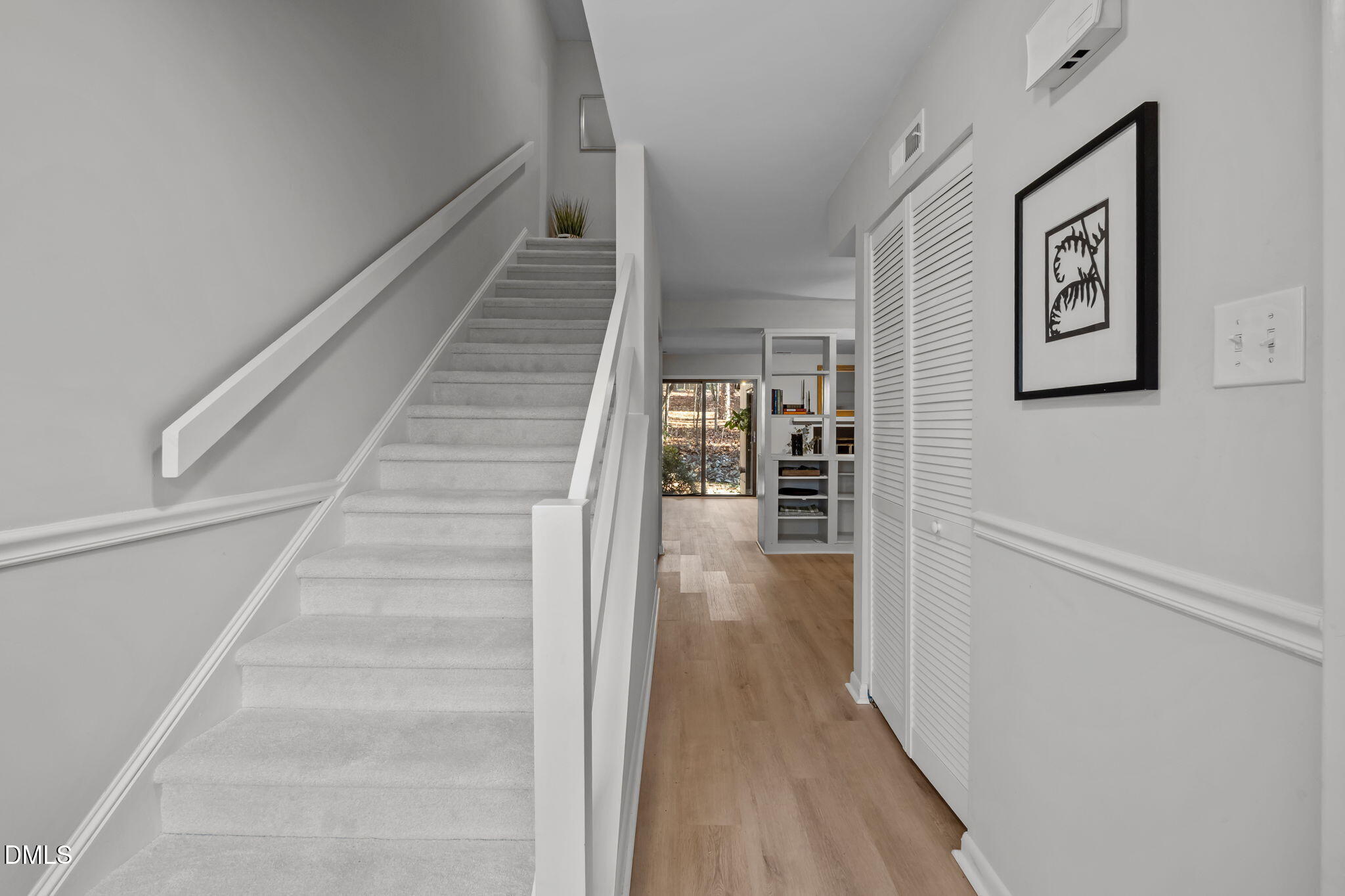 3080 Colony Road, Unit 3080C Durham, NC 27705 - Photo 4 of 57 a view of a hallway with wooden floor and staircase