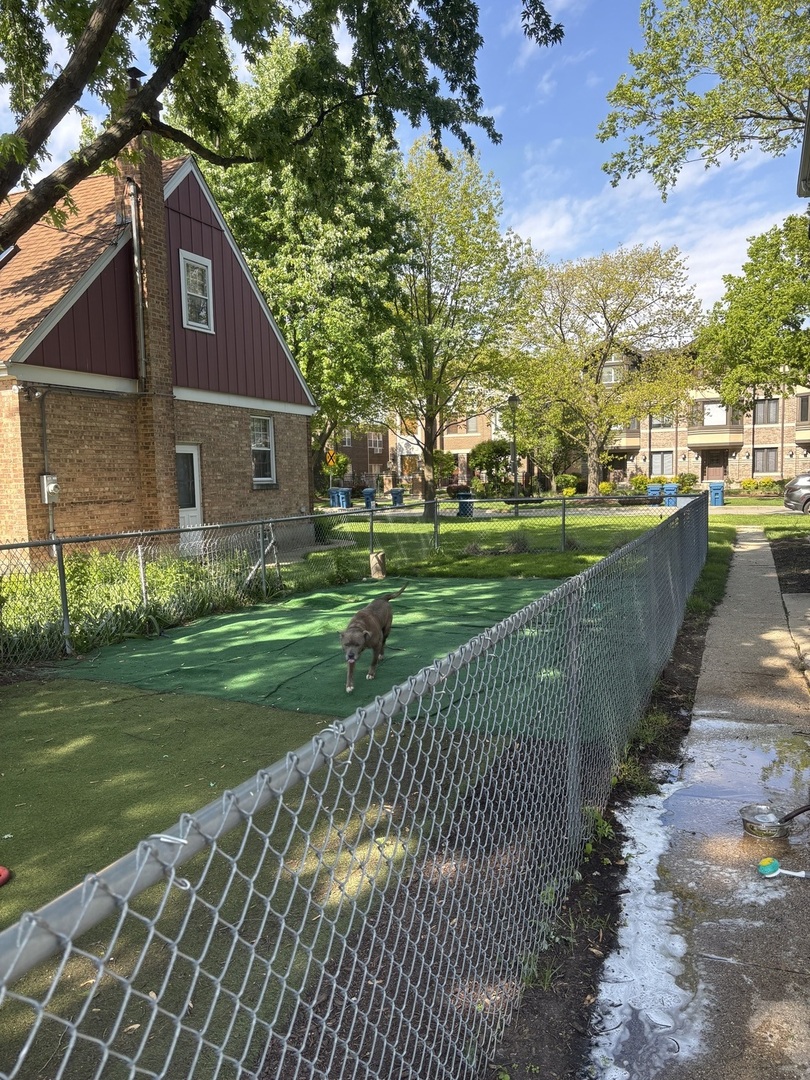 115 North Myrtle Avenue, Unit 2F Elmhurst, IL 60126 - Photo 14 of 14 a view of a brick house next to a yard with big trees