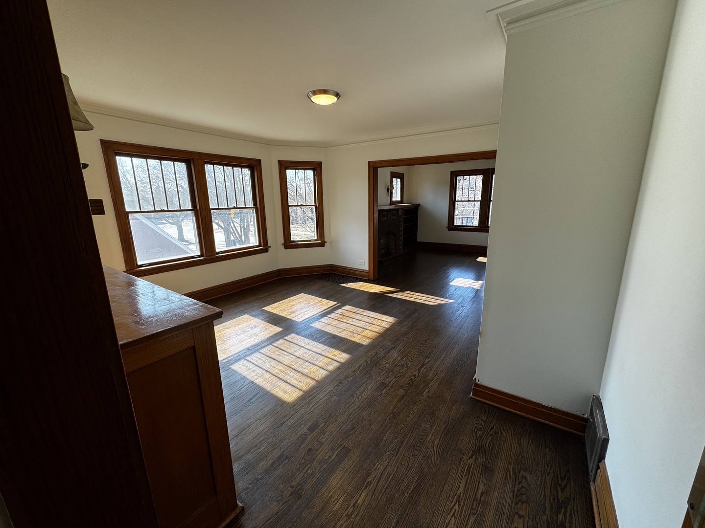 115 North Myrtle Avenue, Unit 2F Elmhurst, IL 60126 - Photo 2 of 14 a view of an empty room with wooden floor and a window