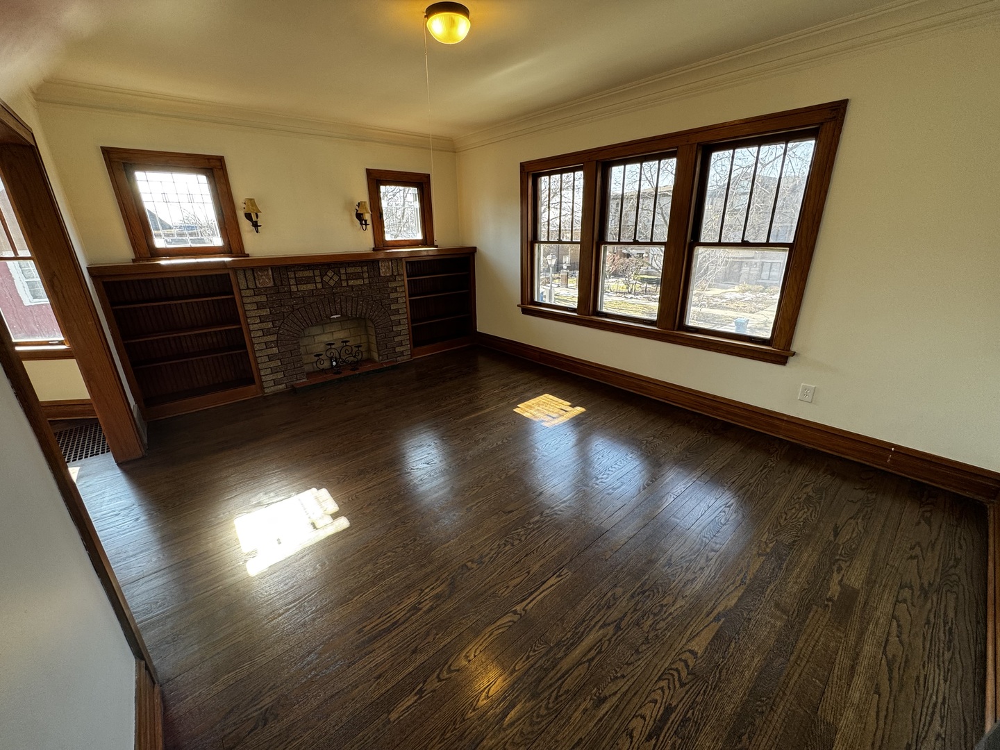 115 North Myrtle Avenue, Unit 2F Elmhurst, IL 60126 - Photo 3 of 14 wooden floor in an empty room with a window