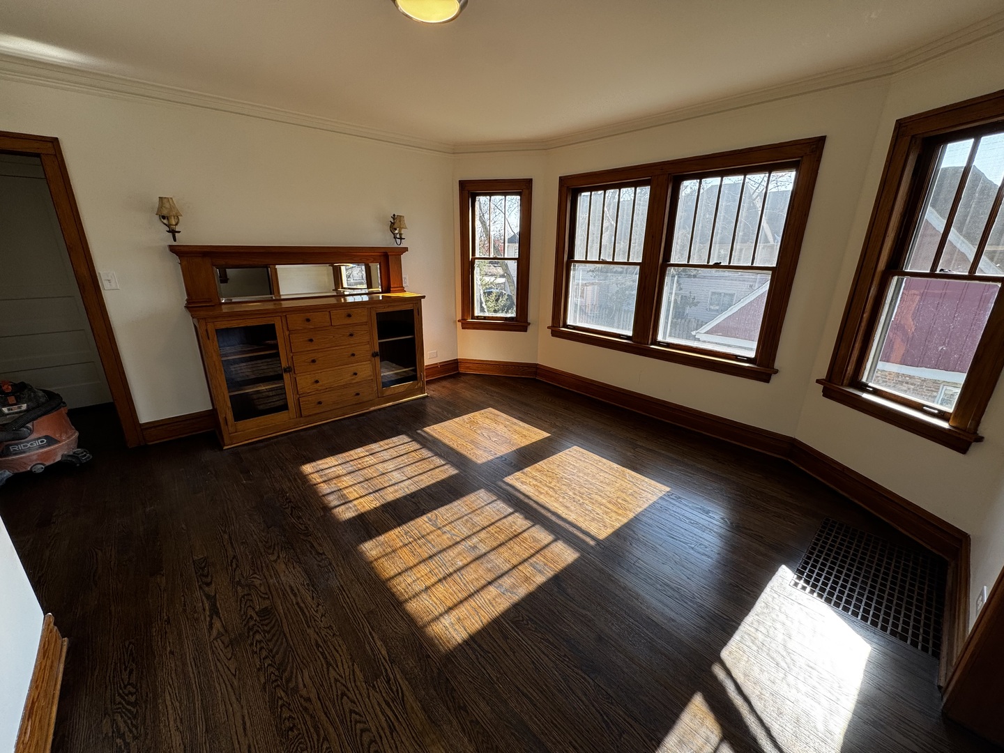 115 North Myrtle Avenue, Unit 2F Elmhurst, IL 60126 - Photo 4 of 14 a view of an empty room with wooden floor and a window