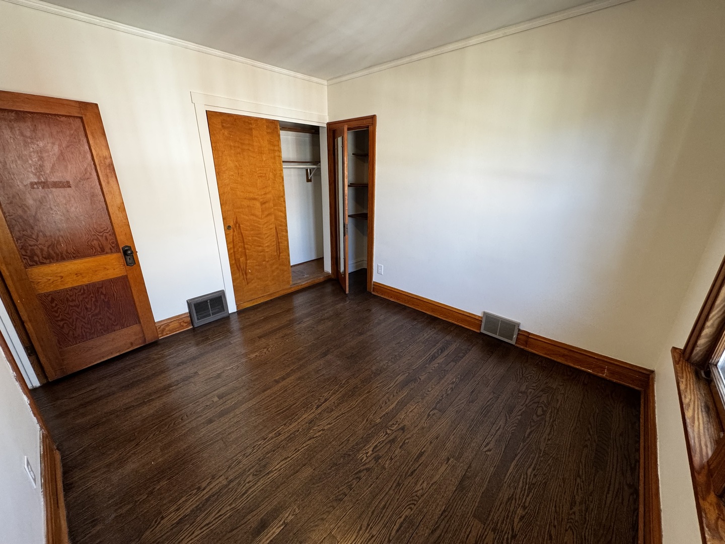 115 North Myrtle Avenue, Unit 2F Elmhurst, IL 60126 - Photo 5 of 14 a view of an empty room with wooden floor and closet