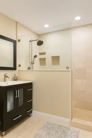 a spacious bedroom with a bed and a couch