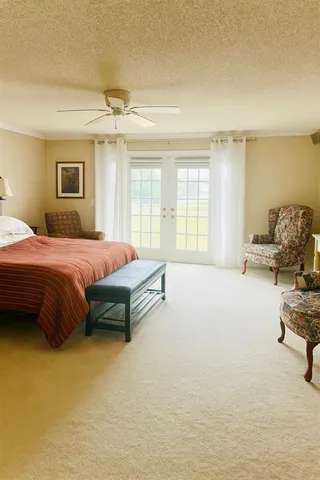 a view of a balcony with wooden floor and fence