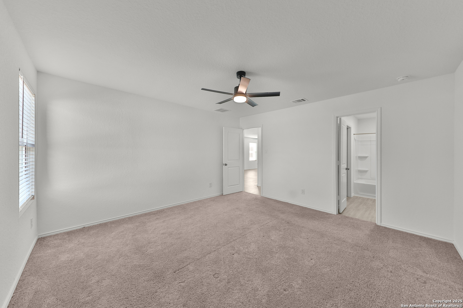 871 Landon Ridge San Antonio, TX 78253 - Photo 12 of 23 a view of an empty room with a ceiling fan