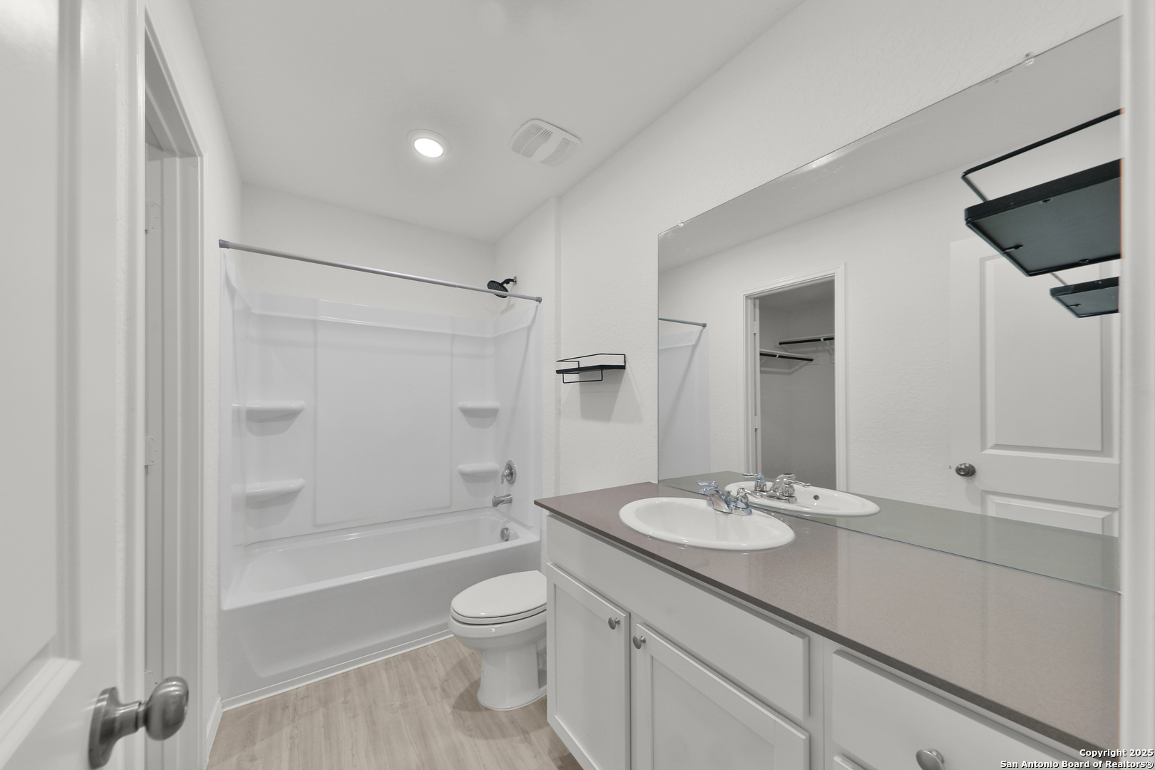 871 Landon Ridge San Antonio, TX 78253 - Photo 13 of 23 a bathroom with a sink a toilet and shower