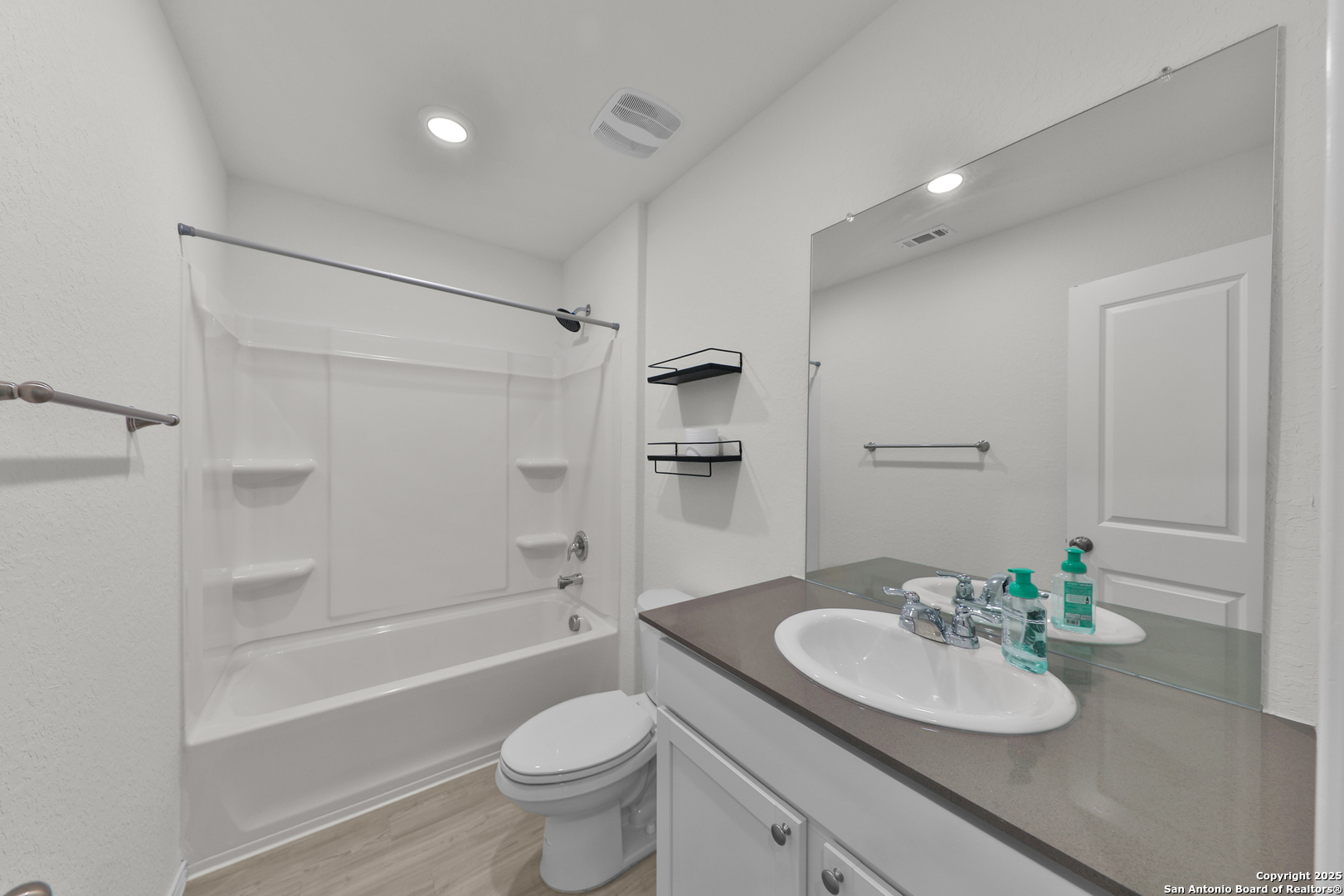 871 Landon Ridge San Antonio, TX 78253 - Photo 17 of 23 a bathroom with a granite countertop sink toilet and shower