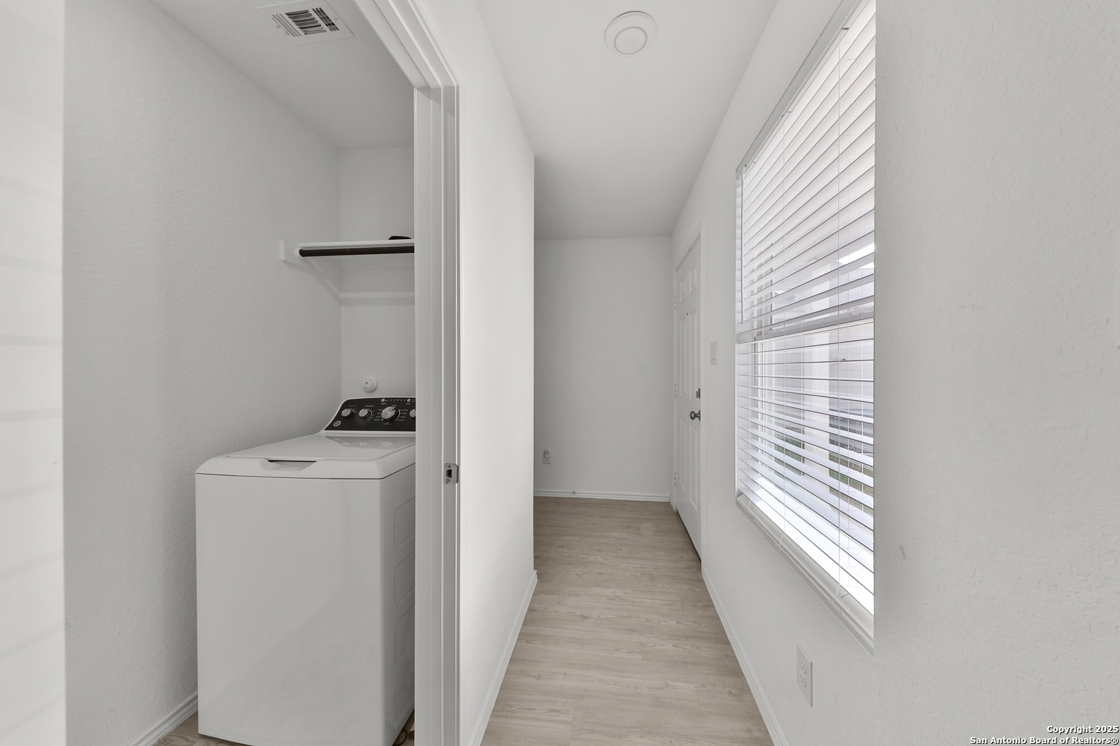 871 Landon Ridge San Antonio, TX 78253 - Photo 20 of 23 a view of a hallway with washer and dryer