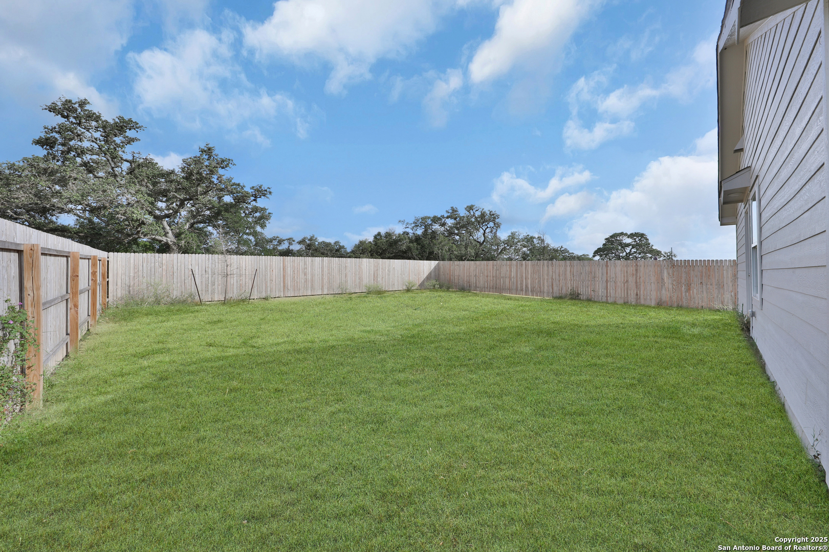 871 Landon Ridge San Antonio, TX 78253 - Photo 23 of 23 a view of yard with swimming pool and wooden fence