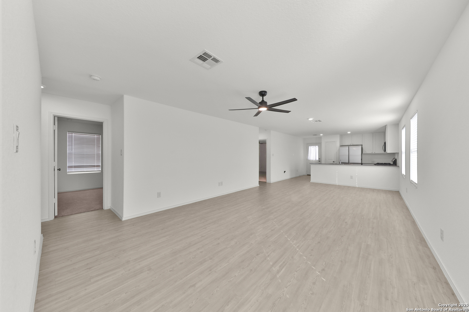 871 Landon Ridge San Antonio, TX 78253 - Photo 4 of 23 a view of empty room with wooden floor and window