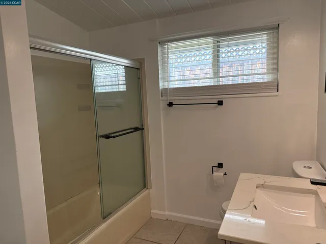 a bathroom with a tub and shower