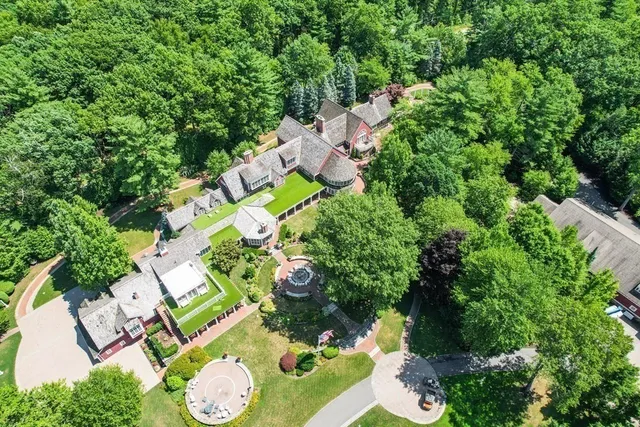 an aerial view of multiple house with yard