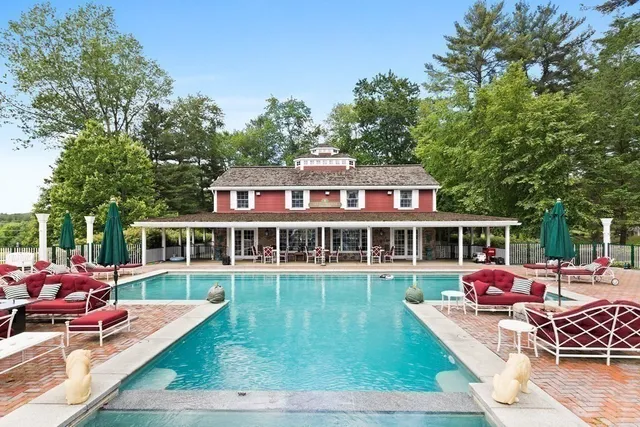 a view of a patio with swimming pool table and chairs