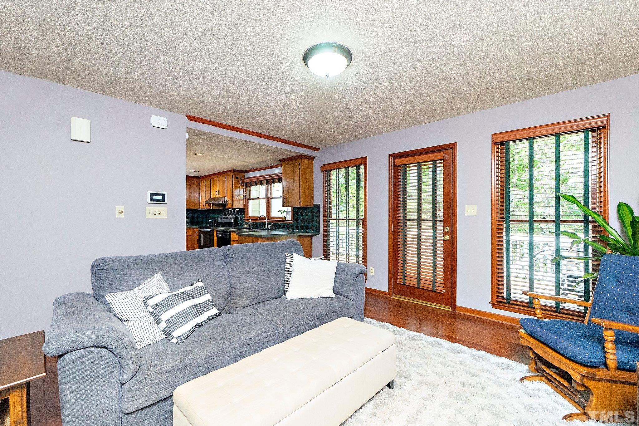 7838 Breckon Way Raleigh, NC 27615 - Photo 10 of 30 a living room with furniture and a table