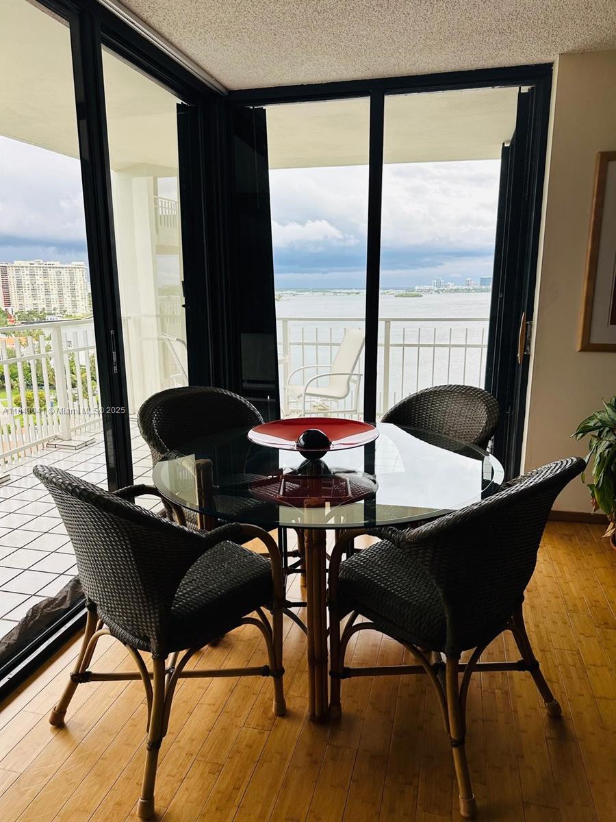 4000 Towerside Terrace, Unit 1503 Miami, FL 33138 - Photo 12 of 23 a view of a dining room with furniture and window