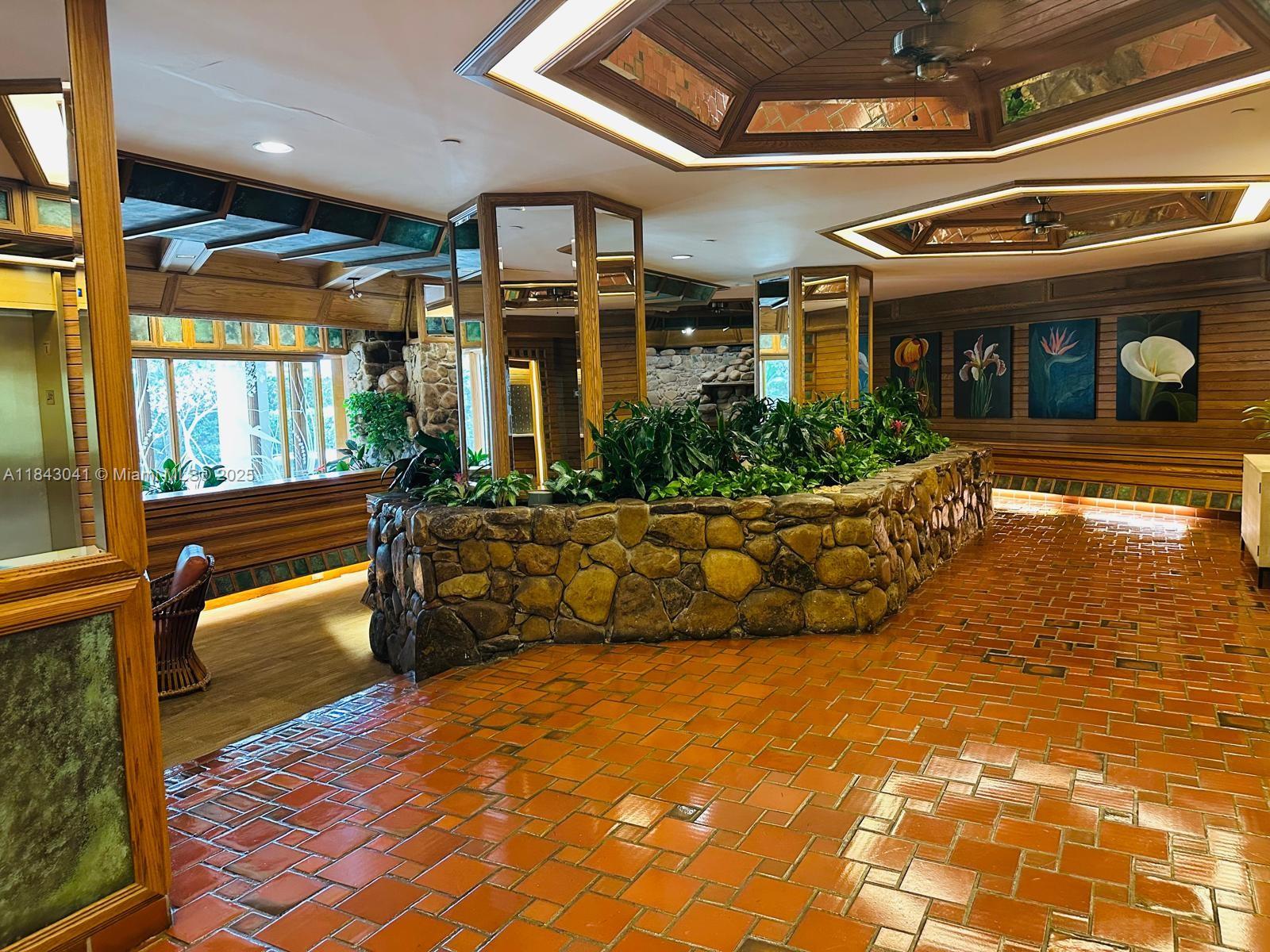 4000 Towerside Terrace, Unit 1503 Miami, FL 33138 - Photo 2 of 23 a front view of a house with a yard