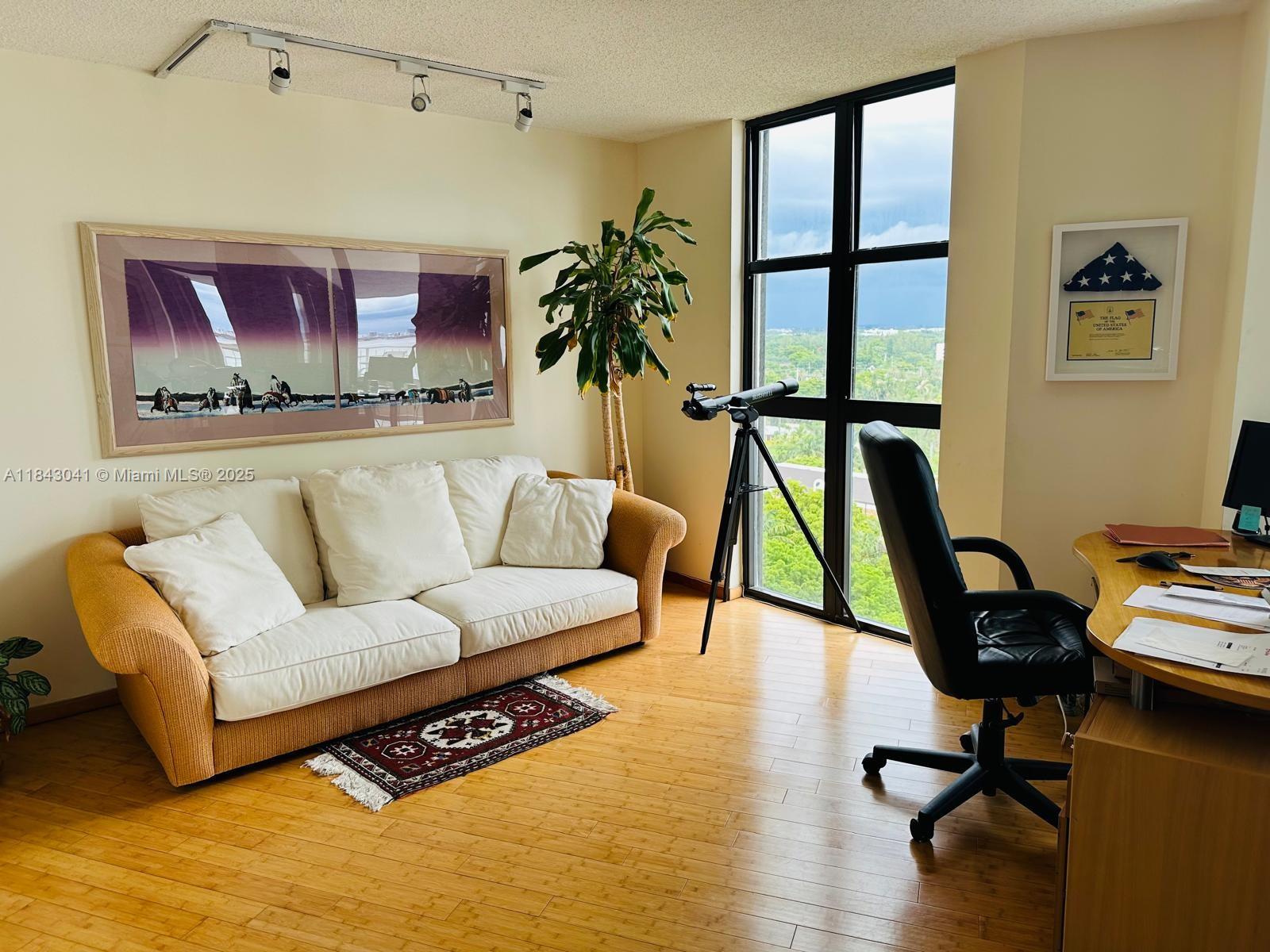 4000 Towerside Terrace, Unit 1503 Miami, FL 33138 - Photo 10 of 23 a living room with furniture