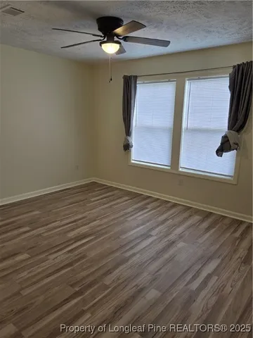 a view of a hallway with a room