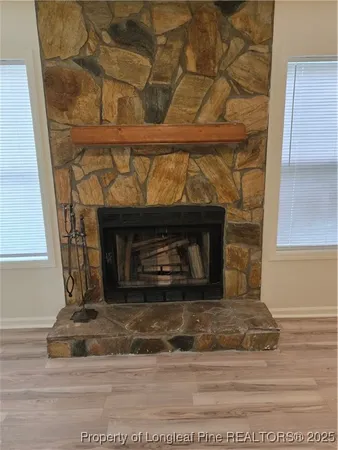 a view of fireplace and a window