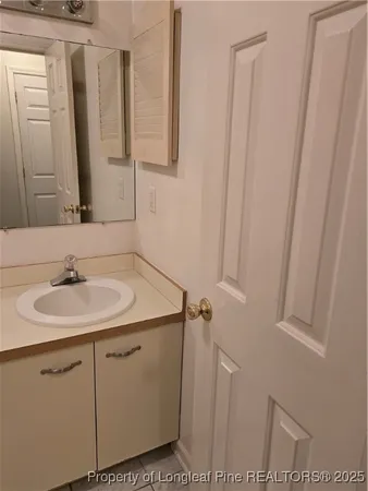 a bathroom with a sink and mirror