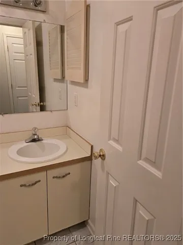 a bathroom with a sink and mirror