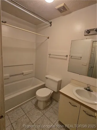 a bathroom with a sink a toilet and a shower