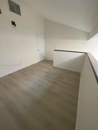 a view of a room with an empty space