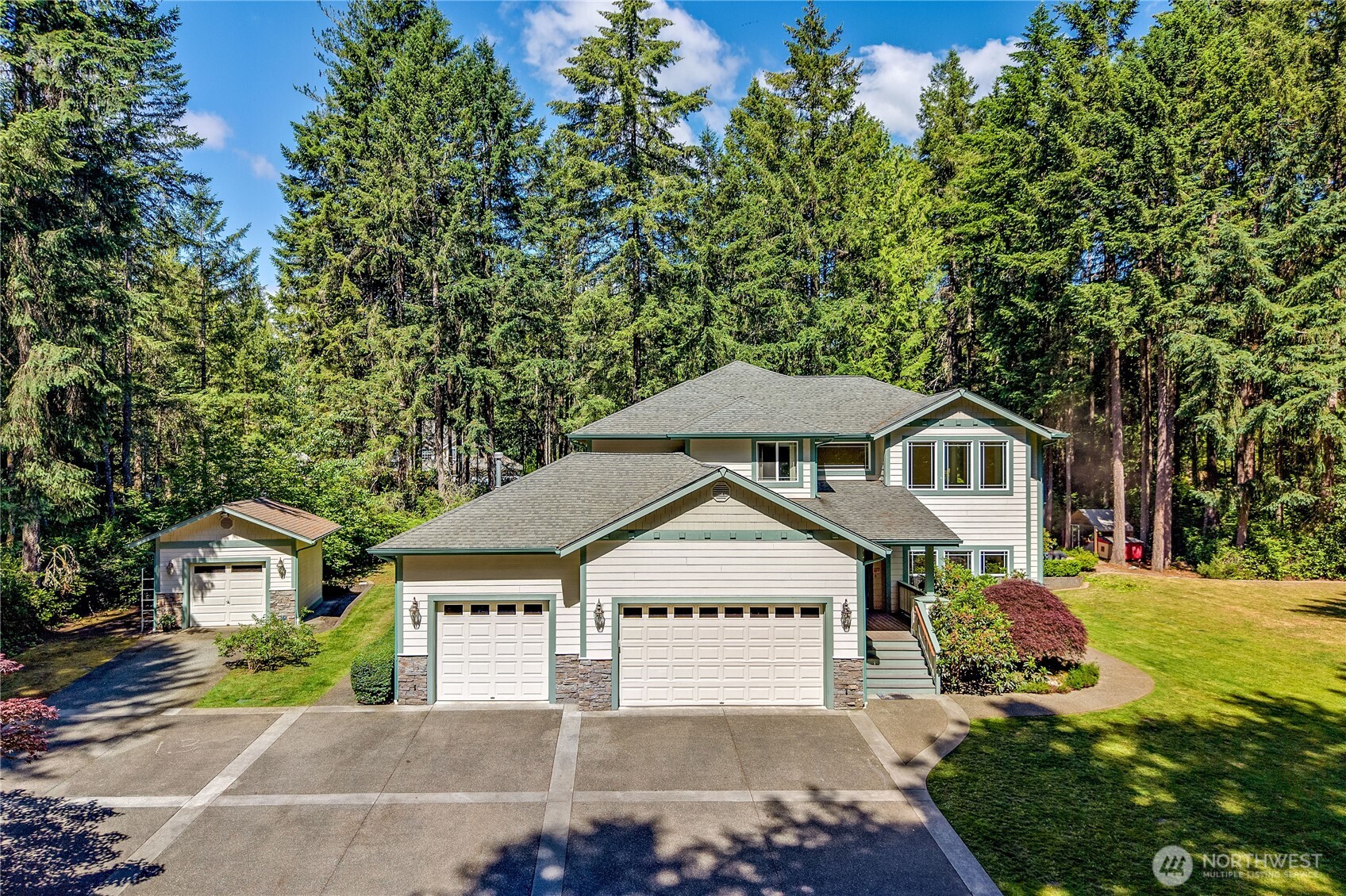 4354 Northwest Westgate Road Silverdale, WA 98383 - Photo 1 of 40 a front view of a house with a garden