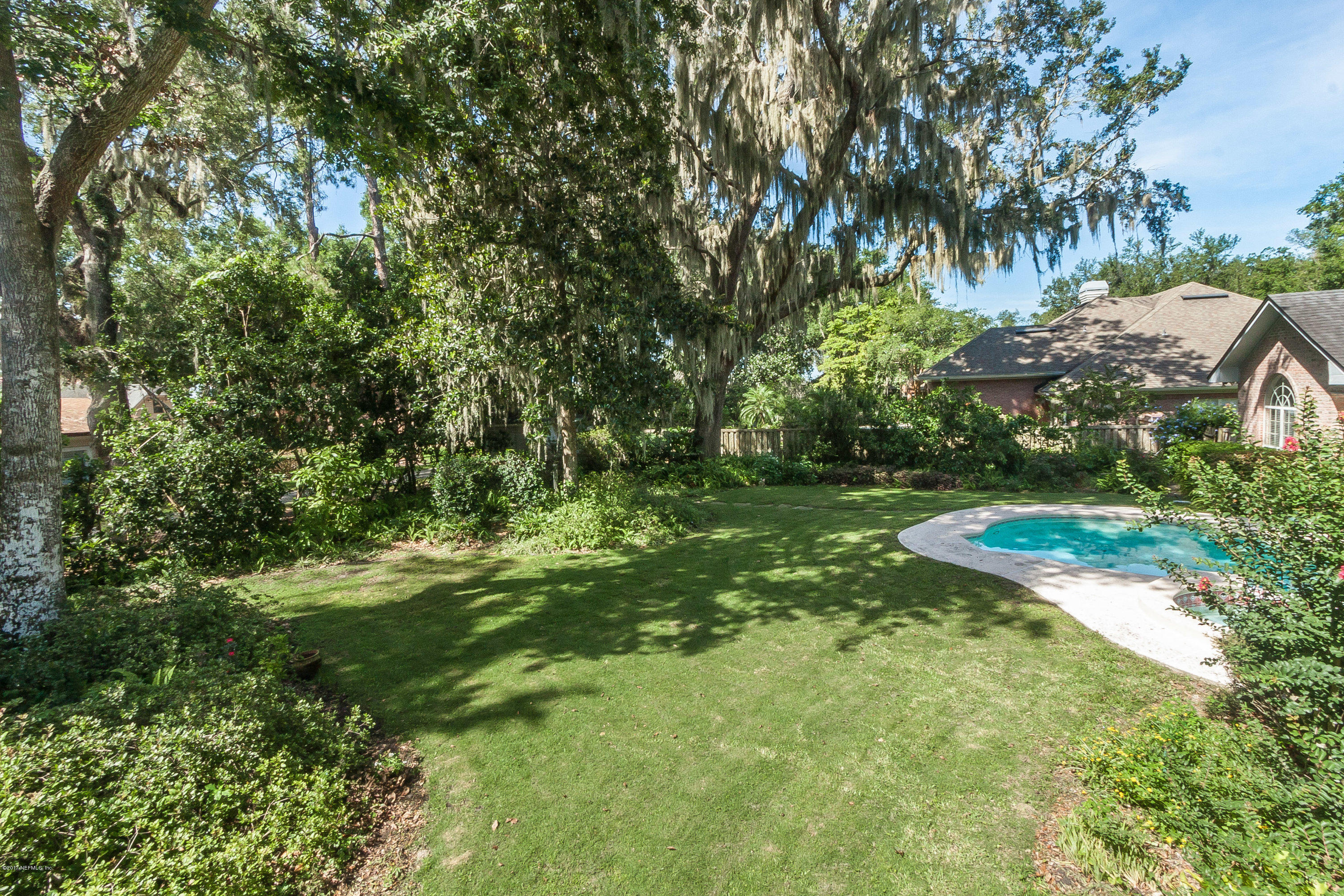 2720 Beauclerc Road Jacksonville, FL 32257 - Photo 42 of 45 a backyard of a house with lots of green space