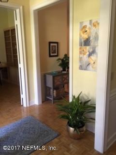 2720 Beauclerc Road Jacksonville, FL 32257 - Photo 9 of 45 a view of a hallway with wooden floor and a potted plant