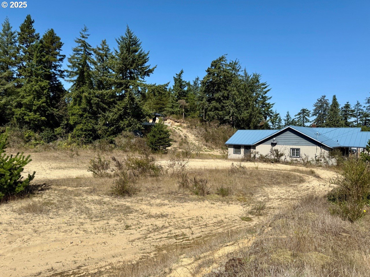 68760 Hauser Road North Bend, OR 97459 - Photo 2 of 6 a view of a large house with a yard