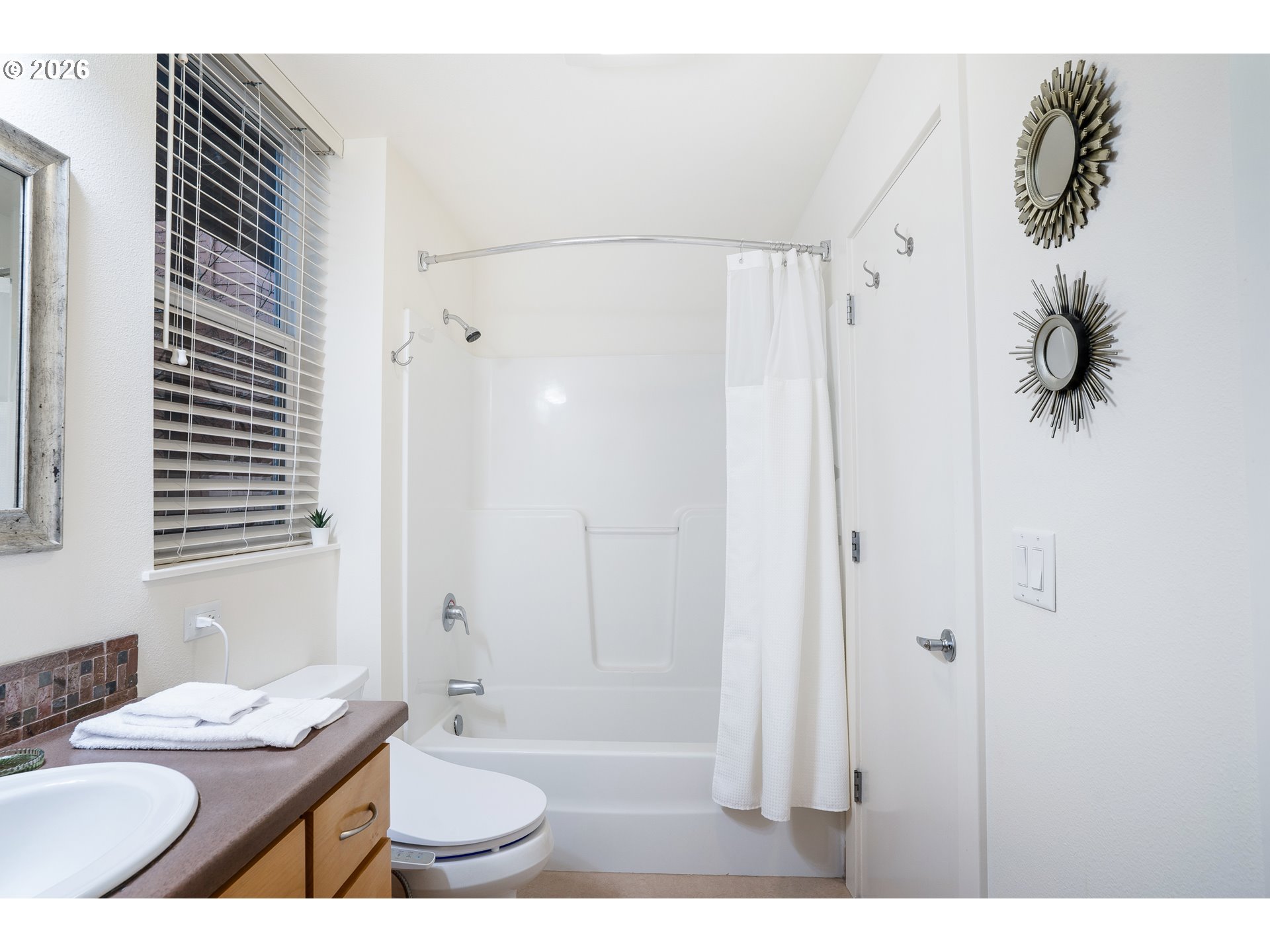 347 Rustic Place, Unit 14 Eugene, OR 97401 - Photo 13 of 20 a bathroom with a granite countertop sink a toilet a mirror and shower