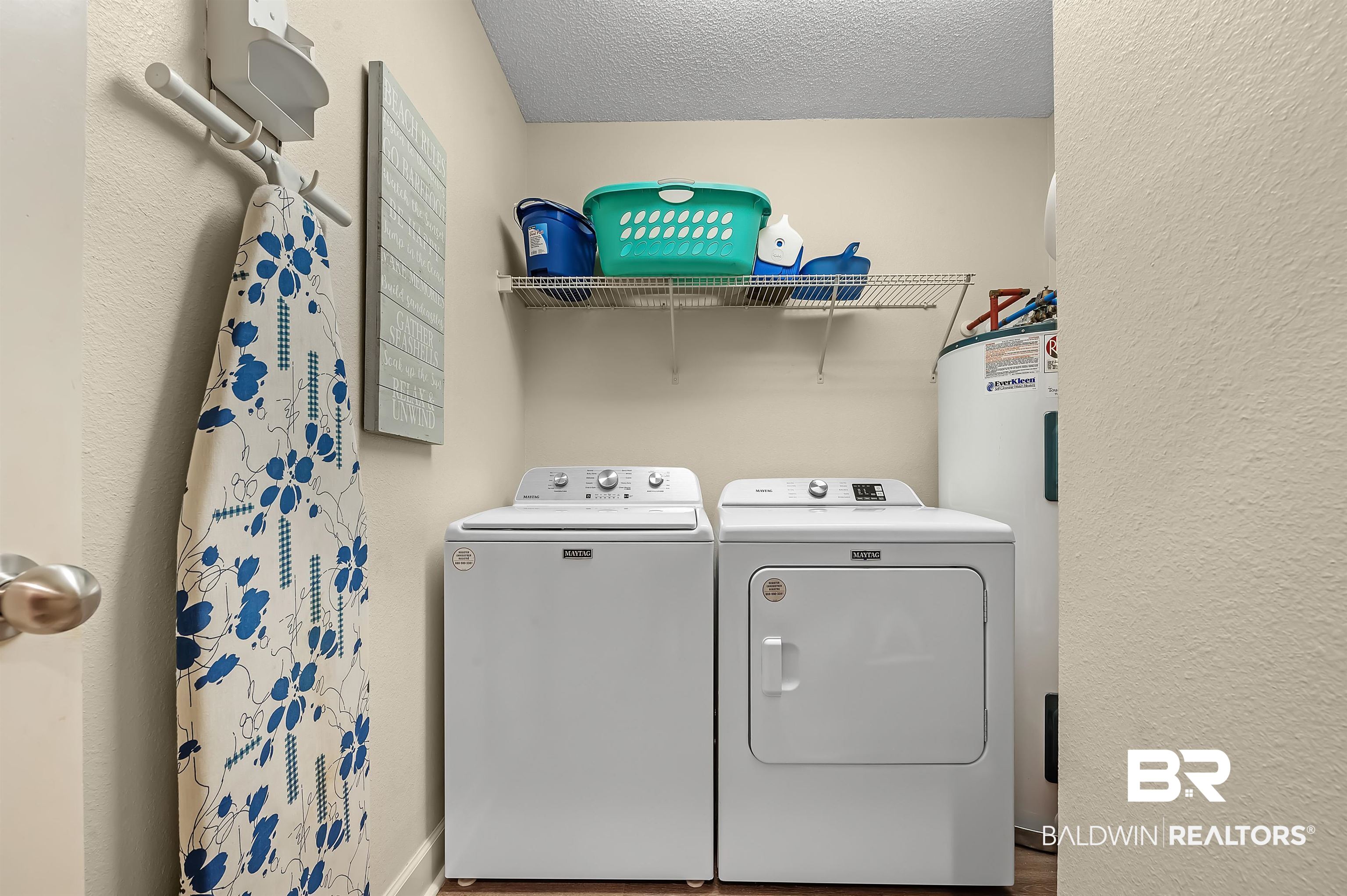 27582 Canal Road, Unit 2104 Orange Beach, AL 36561 - Photo 32 of 35 Clothes washing area featuring wood-type flooring, independent washer and dryer, built in storage and electric water heater