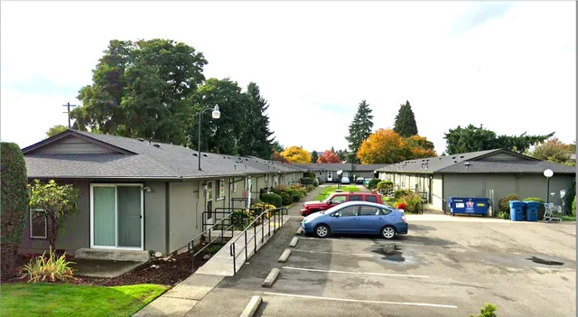 a front view of a house with car parked