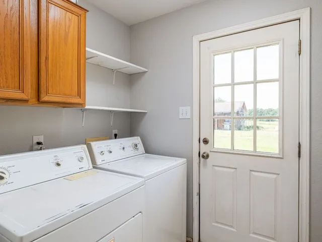 a view of storage room with washer and dryer