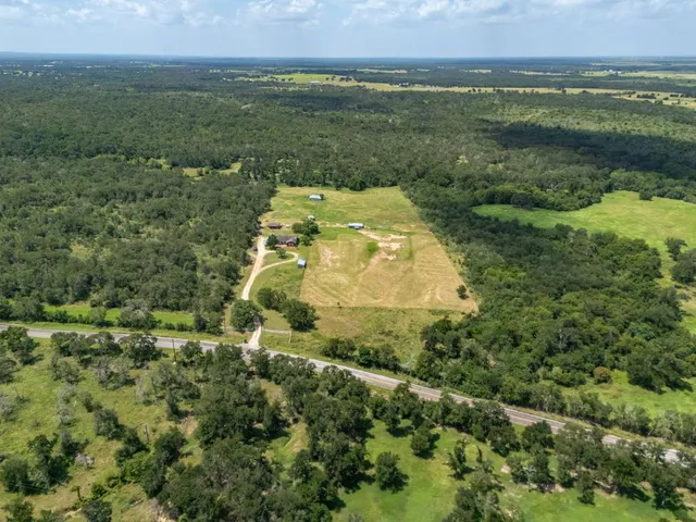 a view of a field with an ocean