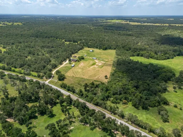 a view of a field with an ocean