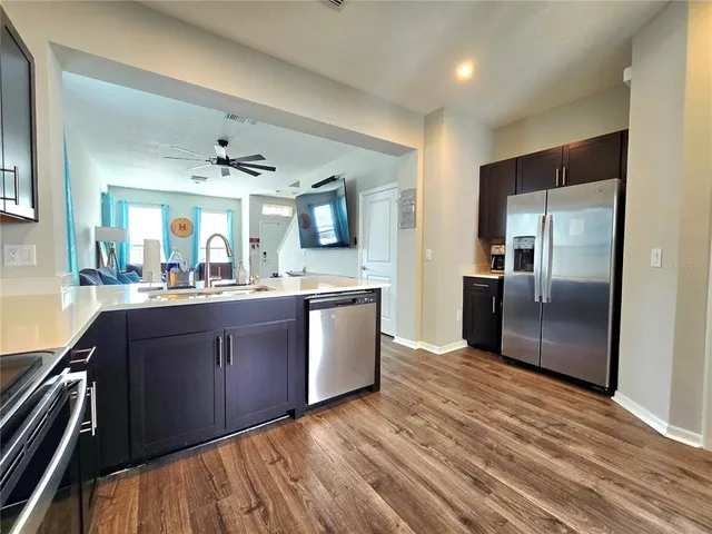 a bathroom with a double vanity sink toilet and a mirror