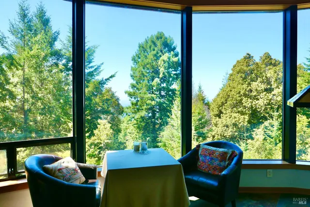 a view of a patio with couches chair and potted plants