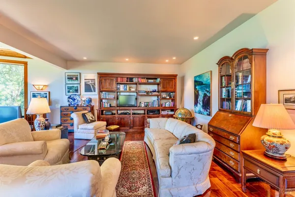 a living room with fireplace furniture and a fireplace