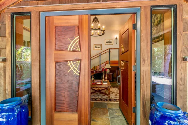 a view of a closet and a door