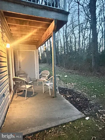 a view of a chairs and table in the patio